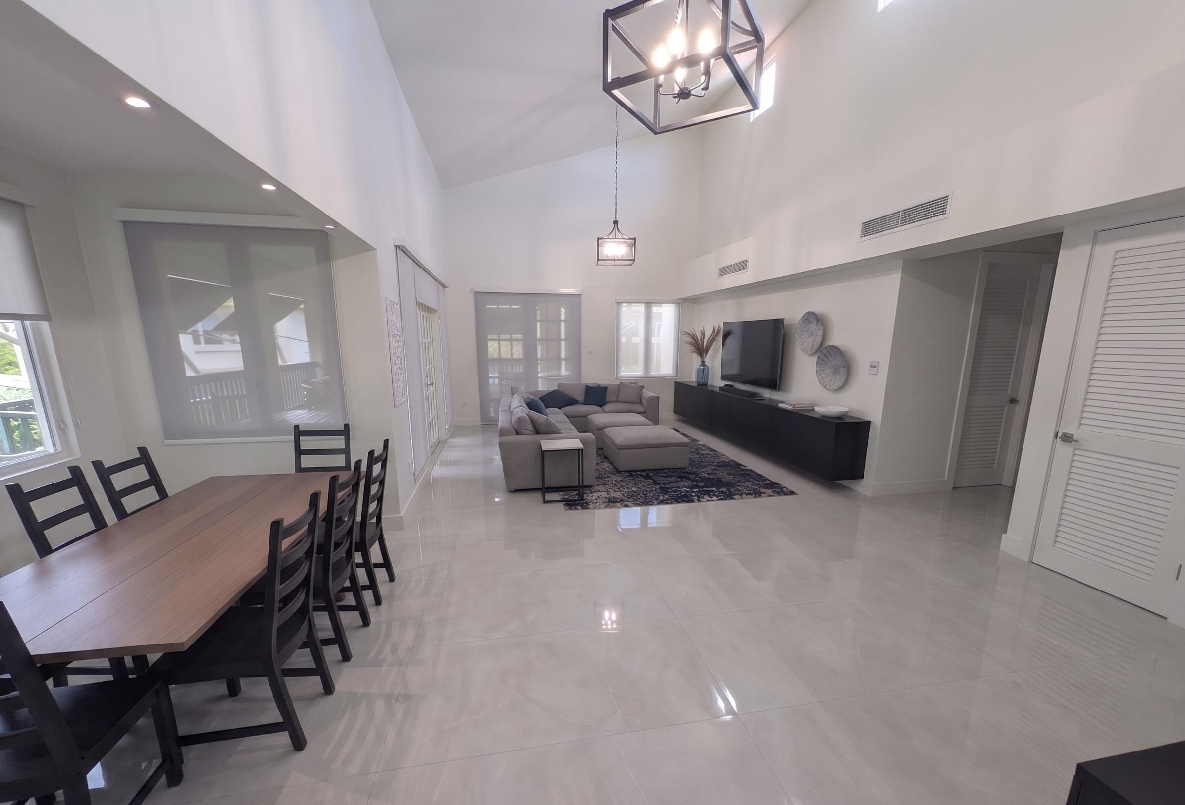 Dining area and living room with 20-foot vaulted ceilings, alternate view