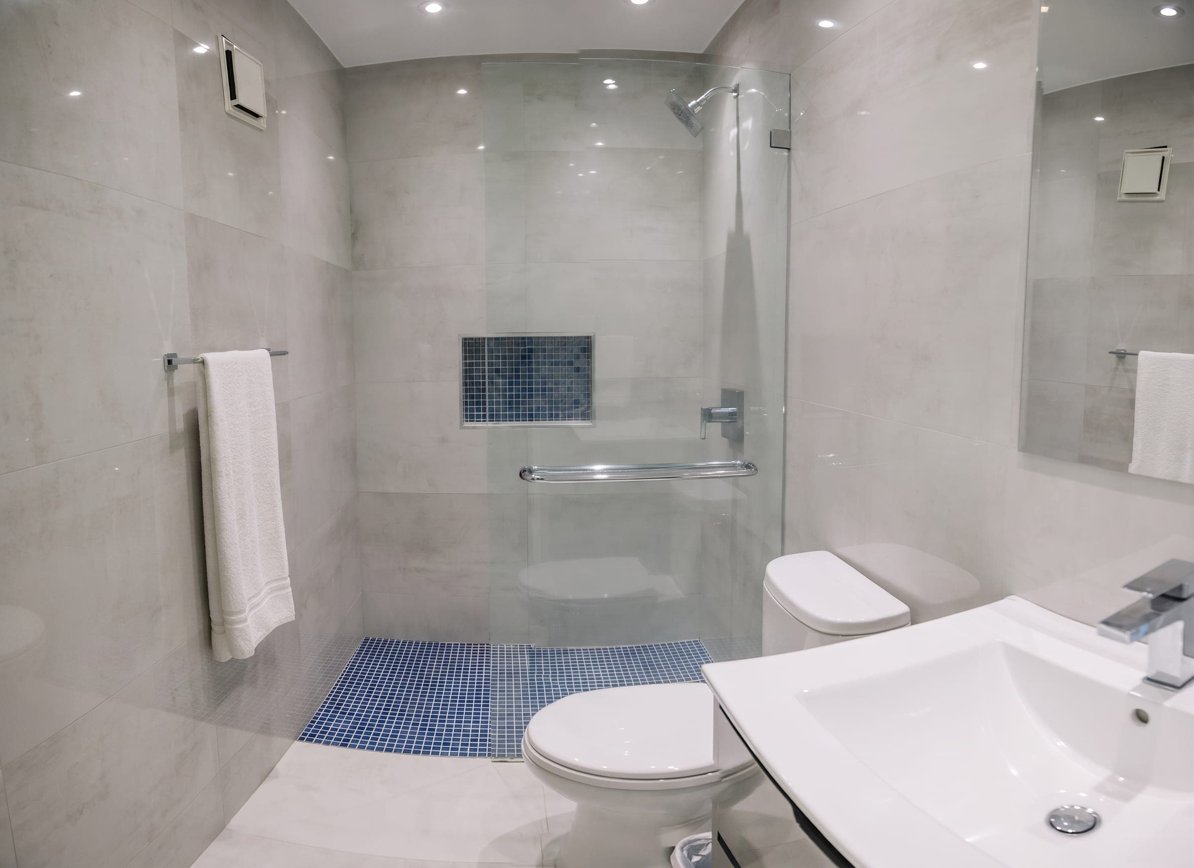 Secondary bathroom with walk-in shower and mosaic tile accent